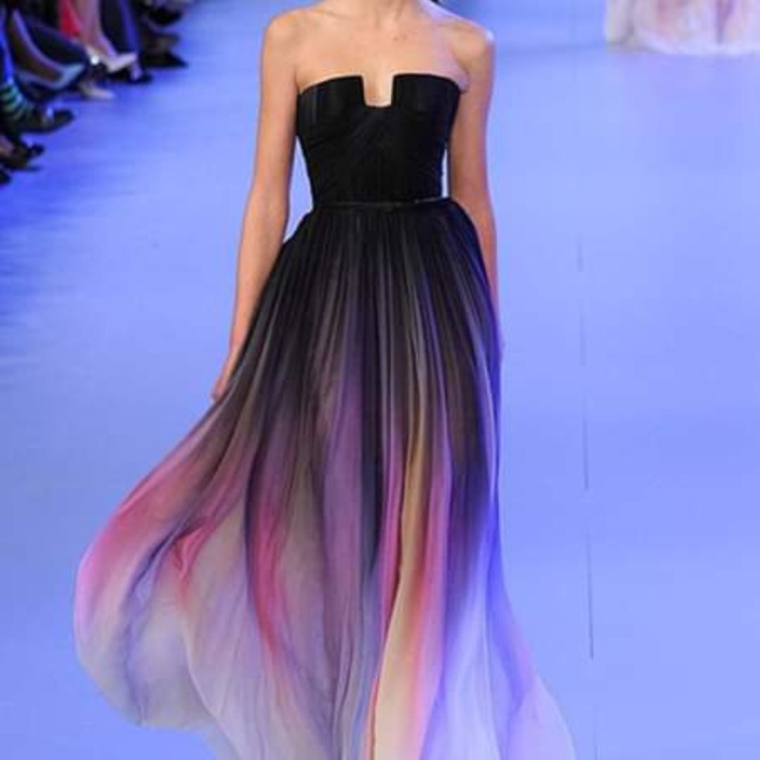 A sweet, flowing, pink-purple gradient strapless long evening dress.