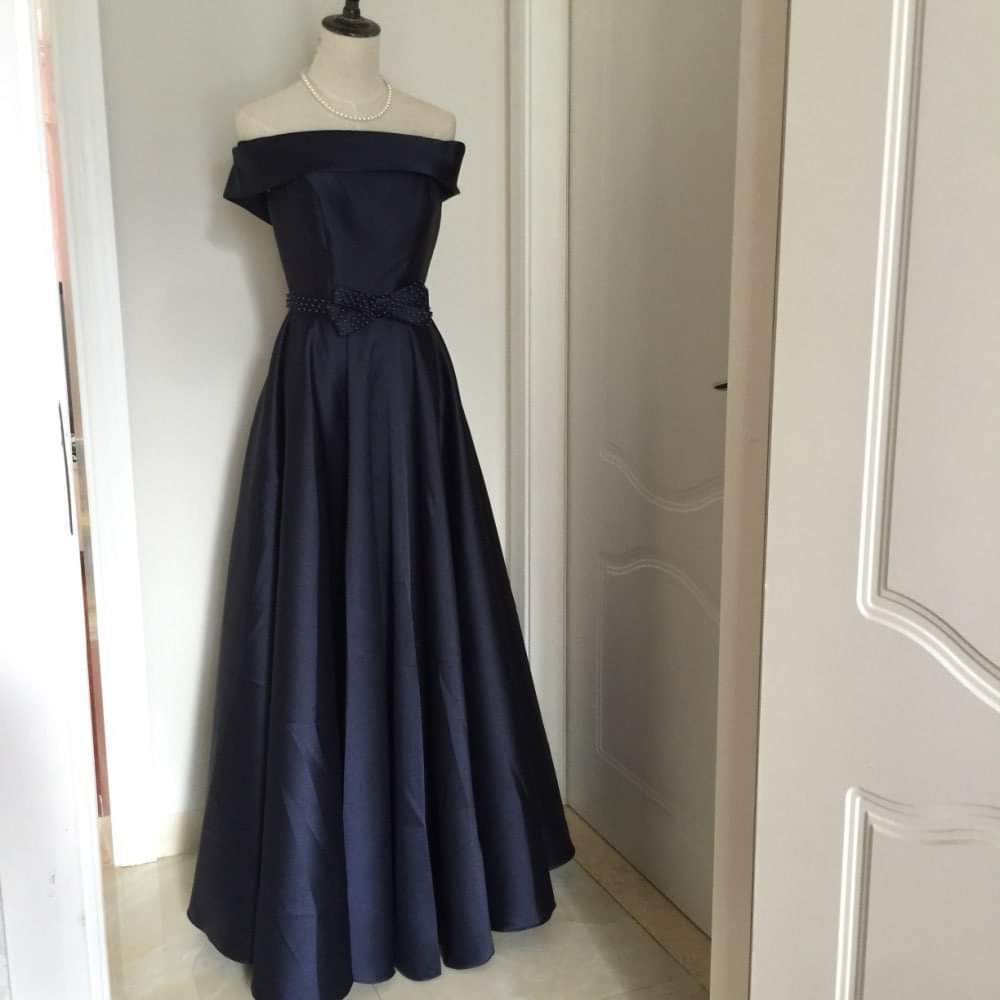 Navy blue off-shoulder long dress with a bow at the waist