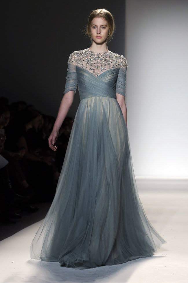 Dark green long evening dress with crystal embellishments and half sleeves